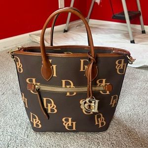 Dark brown and beige Dooney & Burke handbag